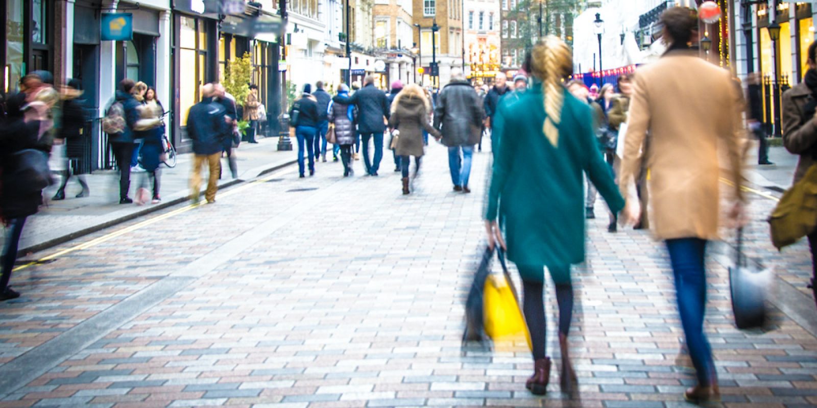 Motion blurred couple on shopping street