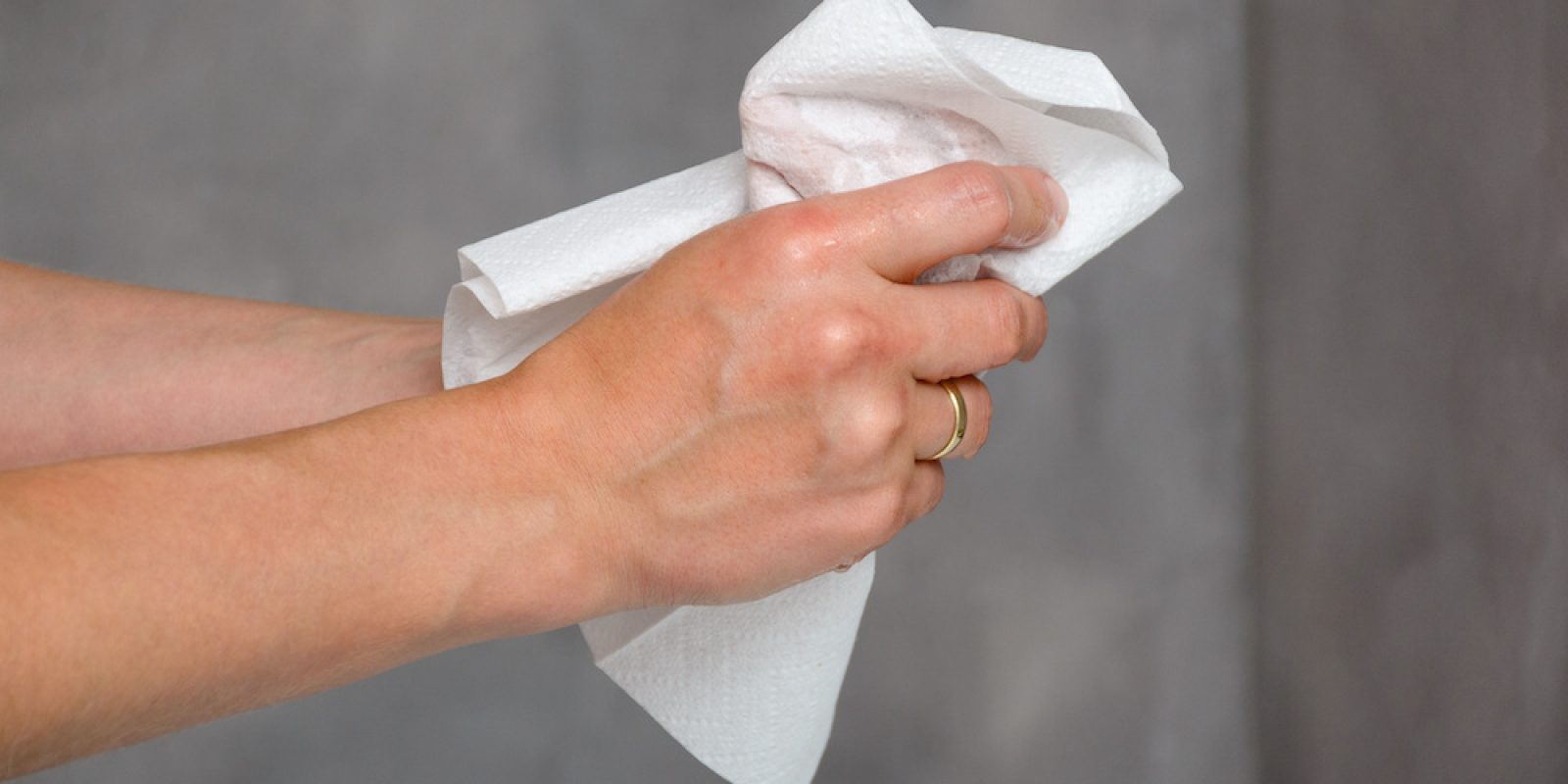 Female hands holding white towel