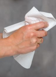Female hands holding white towel
